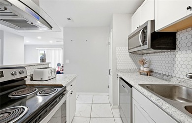 Desirable Lakewood Village featuring laminate and tile flooring - photo 7