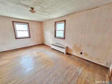 Cape cod style home with newer roof, vinyl siding. Located in a - photo 7