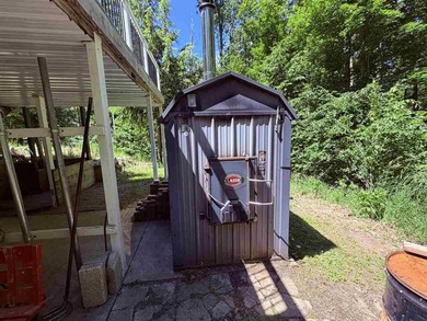 Resort Township home on a private 2.69-acre wooded parcel with - photo 3