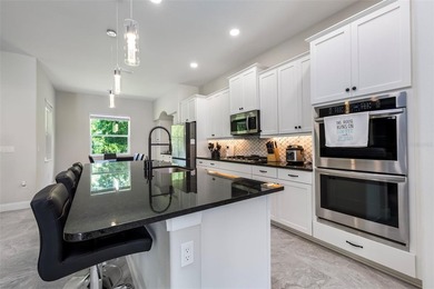 Welcome to this stunning 2023 custom-built smart home, offering - photo 17
