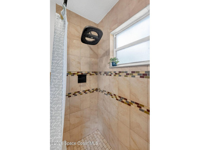 Set on an oversized .46-acre lot with mature trees, this - photo 18