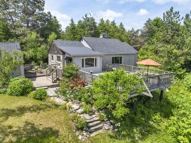 Welcome to this spacious 3 bedroom home in Charlevoix set on 4.2 - photo 2