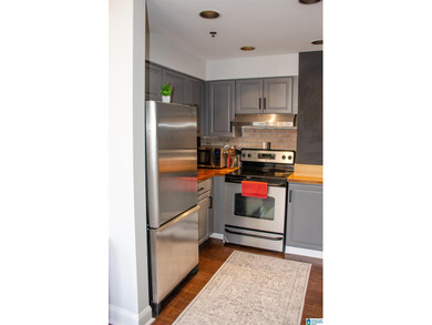 What a fabulous condo in the middle of the Loft District.  Walk