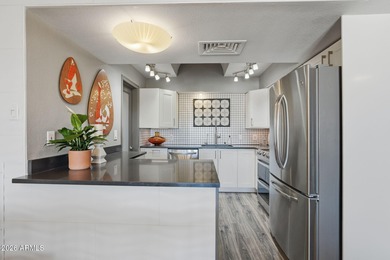Striking mid-century modern 2 bed, 2 bath condo located at The