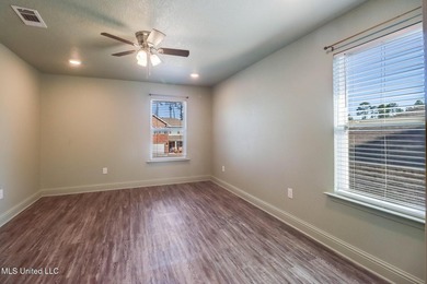 Welcome to this well-maintained four-bedroom home, centrally - photo 15