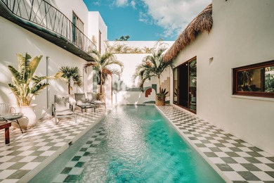 Tucked away in the lush greenery of Tulum's desirable Region 15 - photo 1