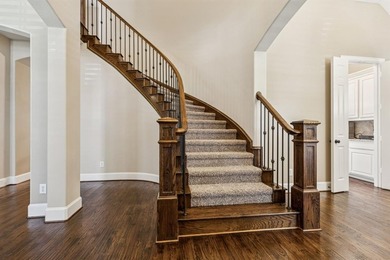 Step into luxury with this pristine custom Highland home