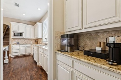 Step into luxury with this pristine custom Highland home