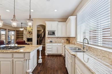 Step into luxury with this pristine custom Highland home