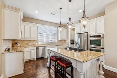 Step into luxury with this pristine custom Highland home