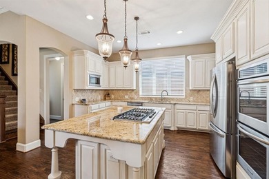 Step into luxury with this pristine custom Highland home