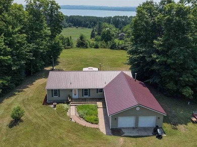Ideally situated between Boyne City and Charlevoix, this - photo 1