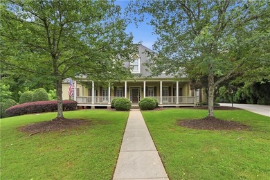 Nestled behind a sweeping lawn on a private, tree-lined lot - photo 1