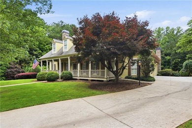 Nestled behind a sweeping lawn on a private, tree-lined lot - photo 3