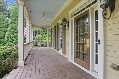Nestled behind a sweeping lawn on a private, tree-lined lot - photo 6