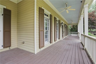Nestled behind a sweeping lawn on a private, tree-lined lot - photo 7