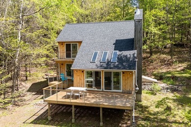 Bovina forest haven. Although this modern Danish-style house was - photo 1