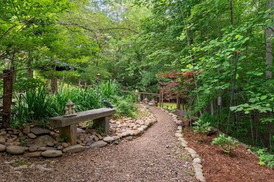 Hidden among the privacy of lush hardwoods in coveted Lake Adger - photo 36