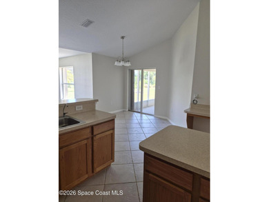 STOP THIS IS THE ONE! THIS HOME OFFERS SOARING VAULTED CEILINGS - photo 7
