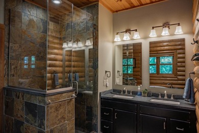 Sweeping lake views in this custom log retreat designed for - photo 17
