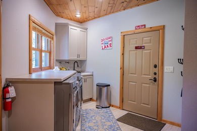 Sweeping lake views in this custom log retreat designed for - photo 18
