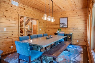 Sweeping lake views in this custom log retreat designed for - photo 19