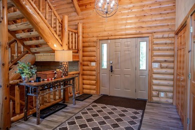 Sweeping lake views in this custom log retreat designed for - photo 22