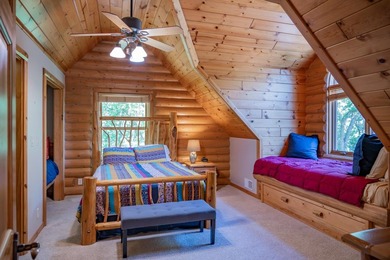 Sweeping lake views in this custom log retreat designed for - photo 24