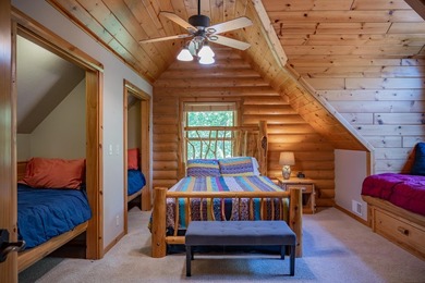 Sweeping lake views in this custom log retreat designed for - photo 25