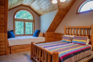Sweeping lake views in this custom log retreat designed for - photo 26