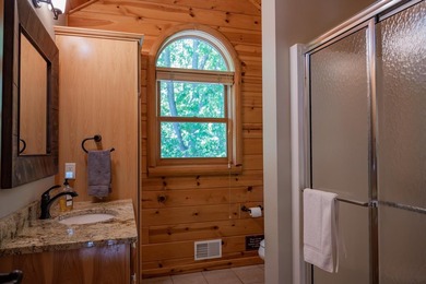 Sweeping lake views in this custom log retreat designed for - photo 28