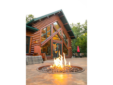 Sweeping lake views in this custom log retreat designed for - photo 40