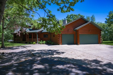 Sweeping lake views in this custom log retreat designed for - photo 43