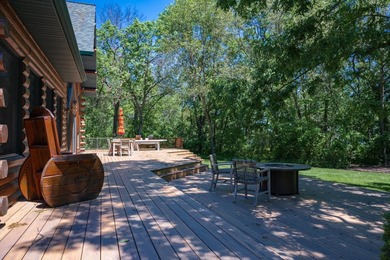 Sweeping lake views in this custom log retreat designed for - photo 44