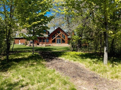 Sweeping lake views in this custom log retreat designed for - photo 45