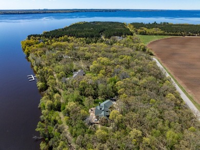 Sweeping lake views in this custom log retreat designed for - photo 48
