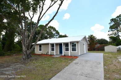 This updated Palm Bay home is set just off a main road, making - photo 1
