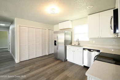 This updated Palm Bay home is set just off a main road, making - photo 5