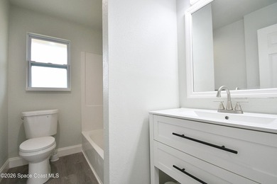 This updated Palm Bay home is set just off a main road, making - photo 7
