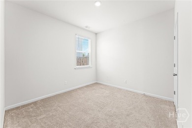 Welcome to this beautiful 4-bedroom, 2-bath home featuring an - photo 11