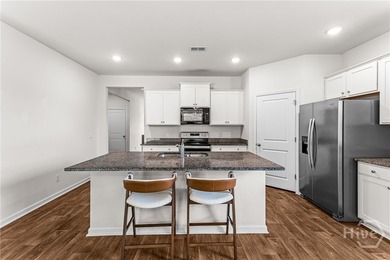Welcome to this beautiful 4-bedroom, 2-bath home featuring an - photo 21