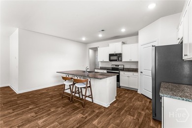 Welcome to this beautiful 4-bedroom, 2-bath home featuring an - photo 22