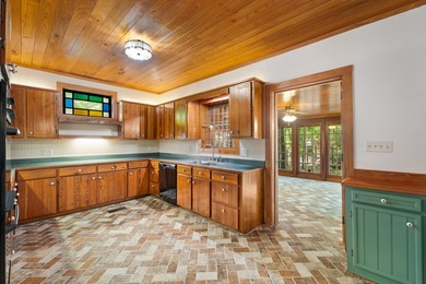 Hidden beneath towering hardwoods on a private wooded setting - photo 11