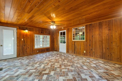 Hidden beneath towering hardwoods on a private wooded setting - photo 15