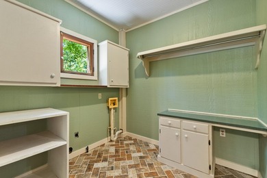 Hidden beneath towering hardwoods on a private wooded setting - photo 17