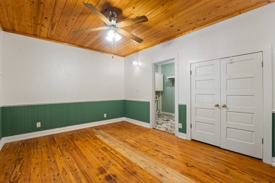 Hidden beneath towering hardwoods on a private wooded setting - photo 19