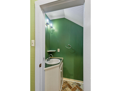 Hidden beneath towering hardwoods on a private wooded setting - photo 20