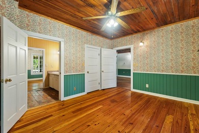 Hidden beneath towering hardwoods on a private wooded setting - photo 22