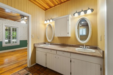 Hidden beneath towering hardwoods on a private wooded setting - photo 24