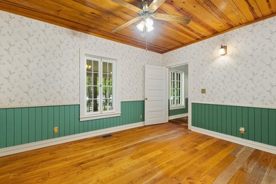 Hidden beneath towering hardwoods on a private wooded setting - photo 26